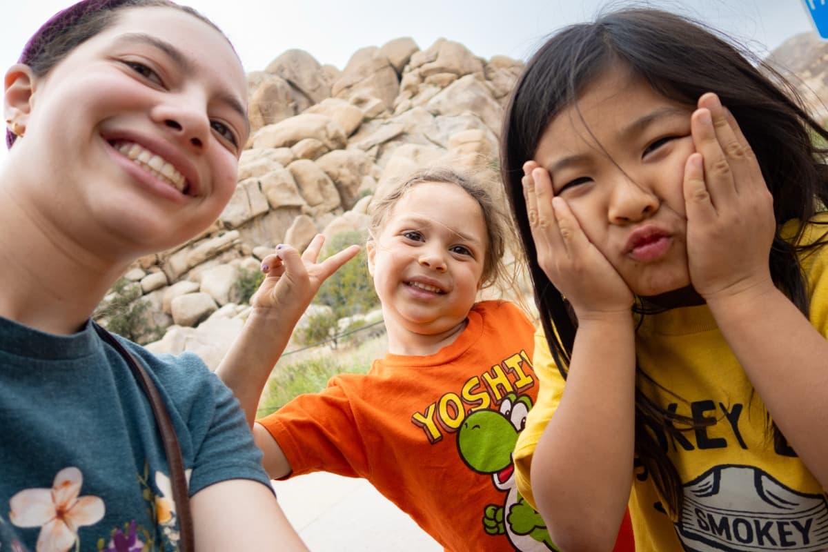 Kids making silly faces on a camping trip