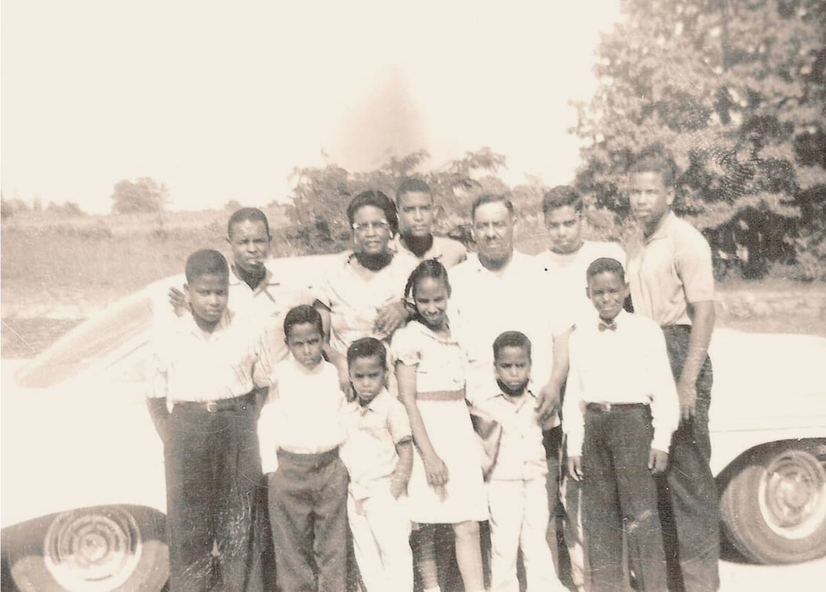 Black American father and twin brother tending gardens