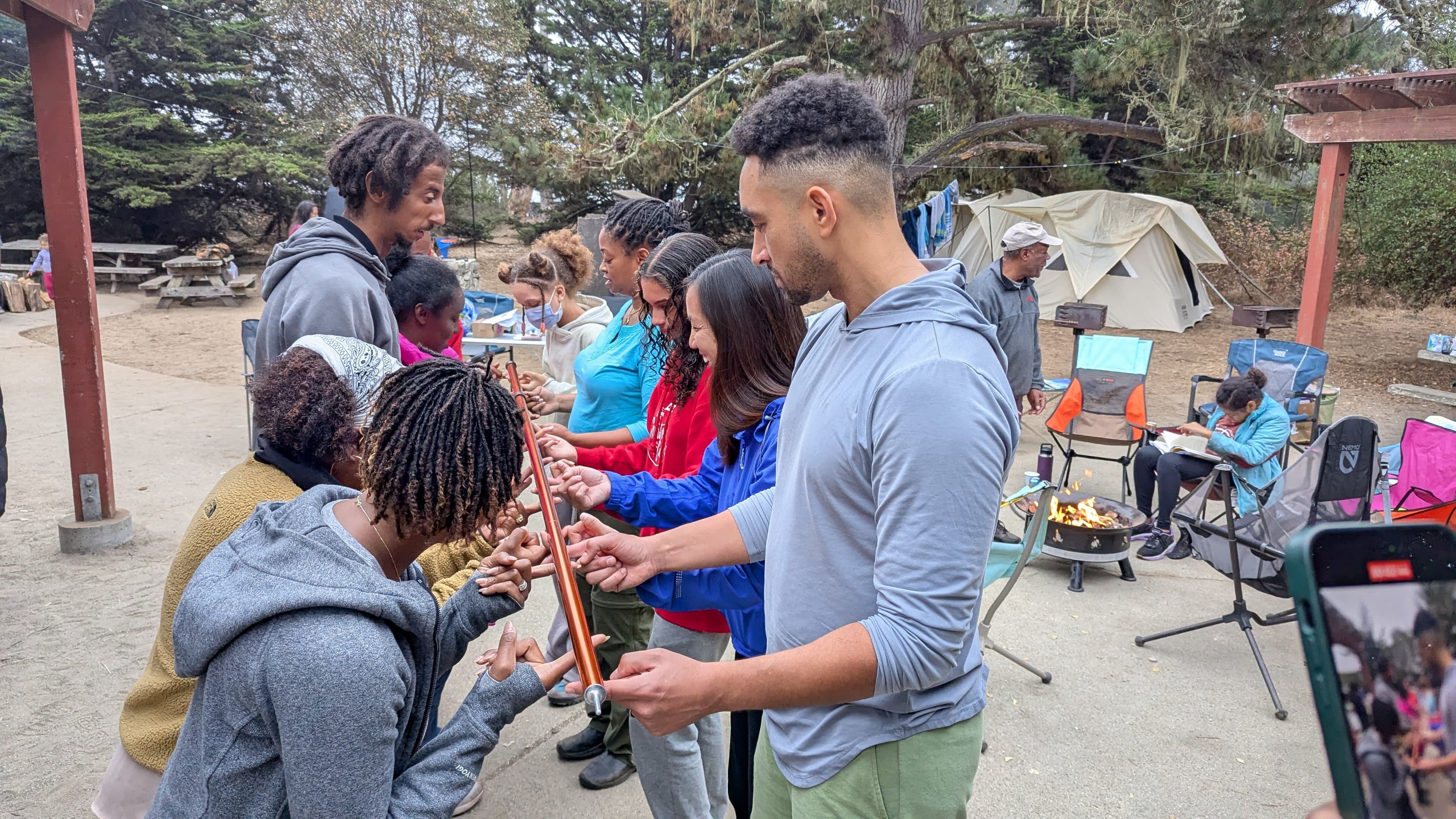 Campers helping each other in a team exercise